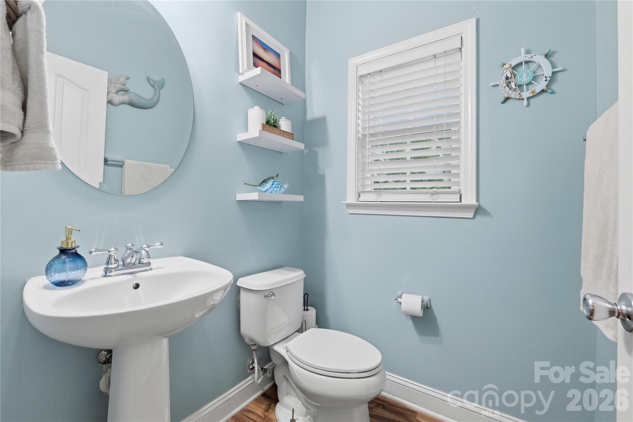 122 Colville Road Mooresville, NC 28117 - Photo 13 of 24 a bathroom with a sink a toilet and a mirror