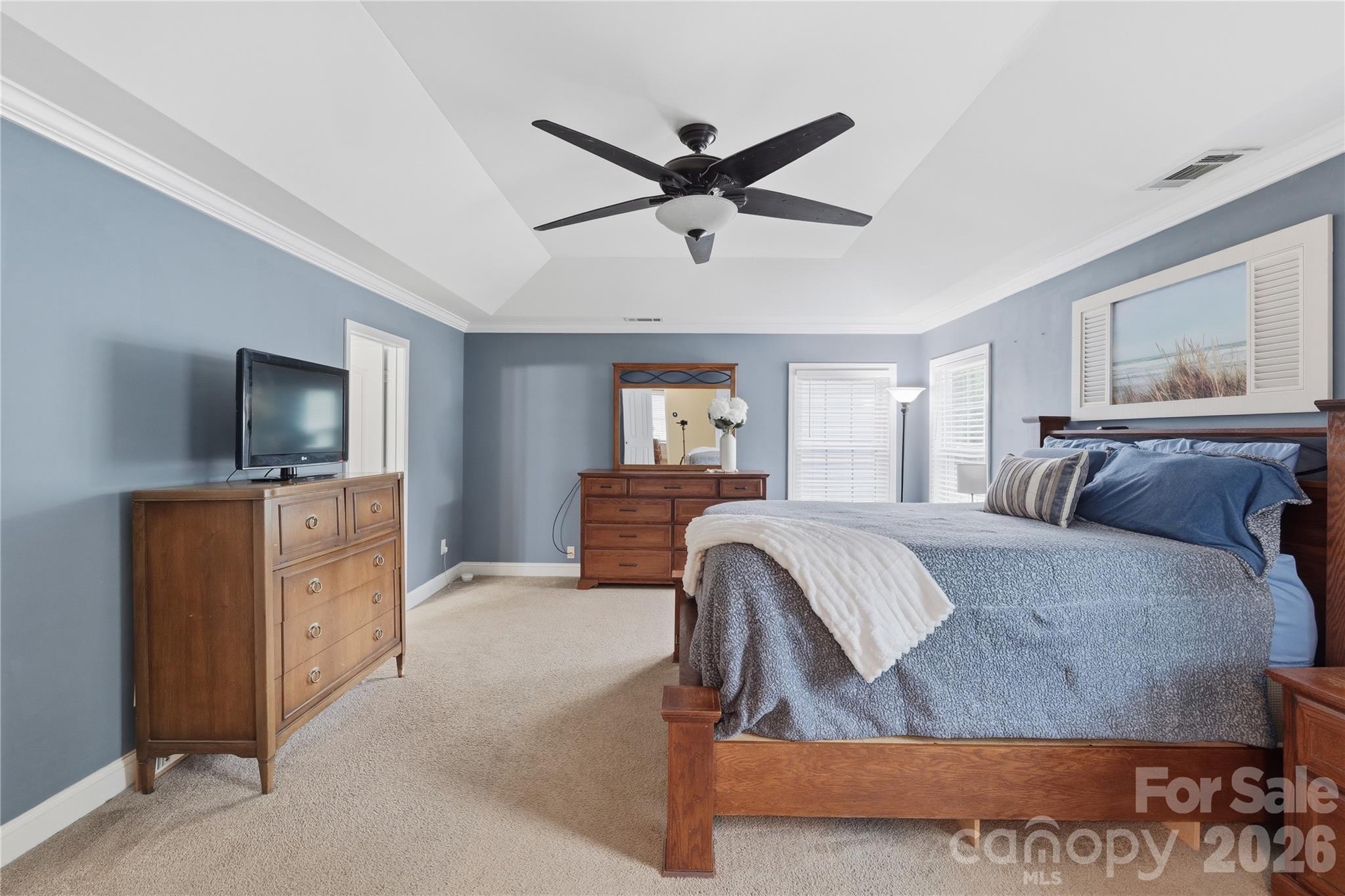 122 Colville Road Mooresville, NC 28117 - Photo 14 of 24 a spacious bedroom with a bed and a flat screen tv