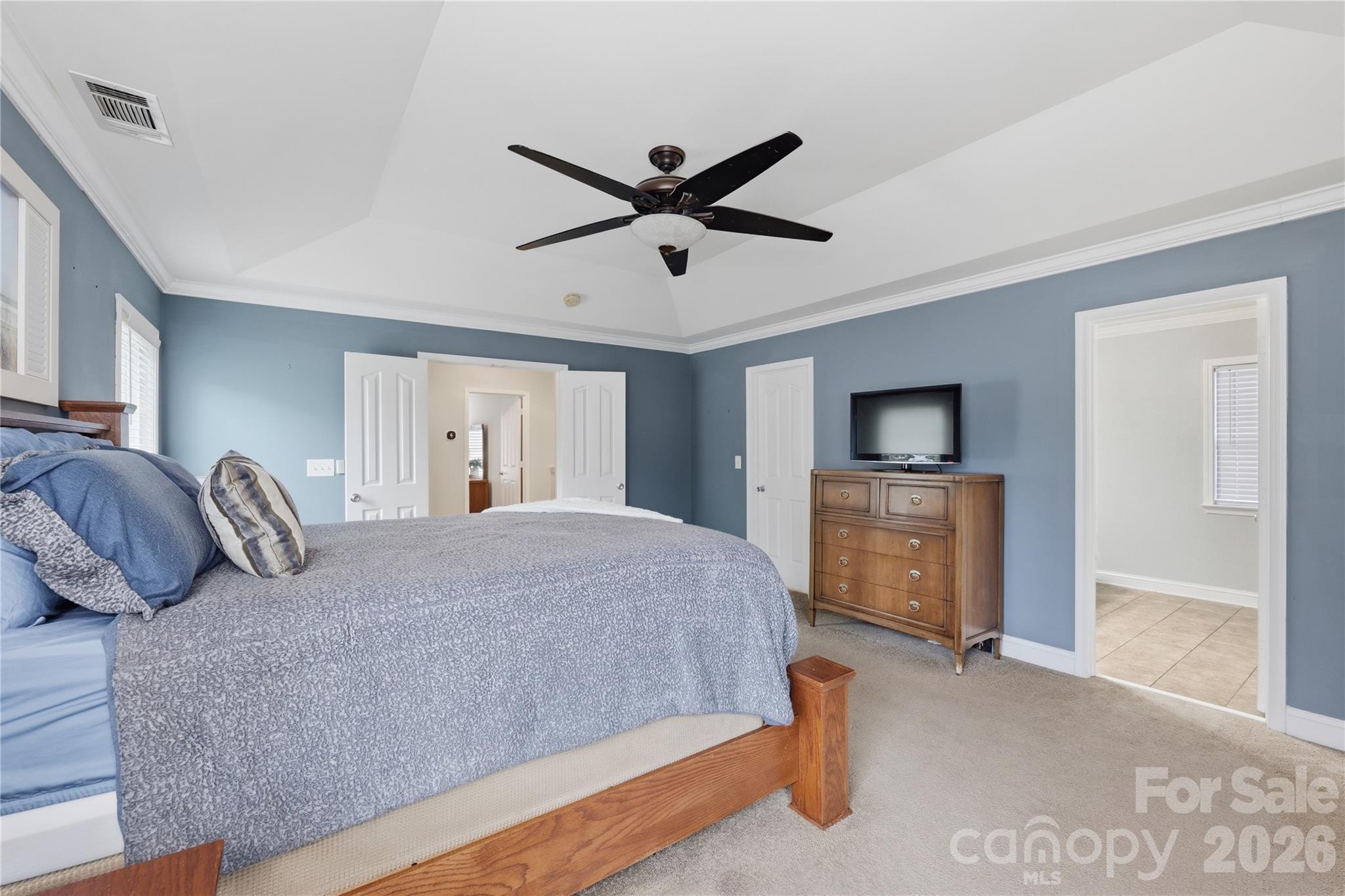 122 Colville Road Mooresville, NC 28117 - Photo 16 of 24 a bedroom with a large bed and a tv
