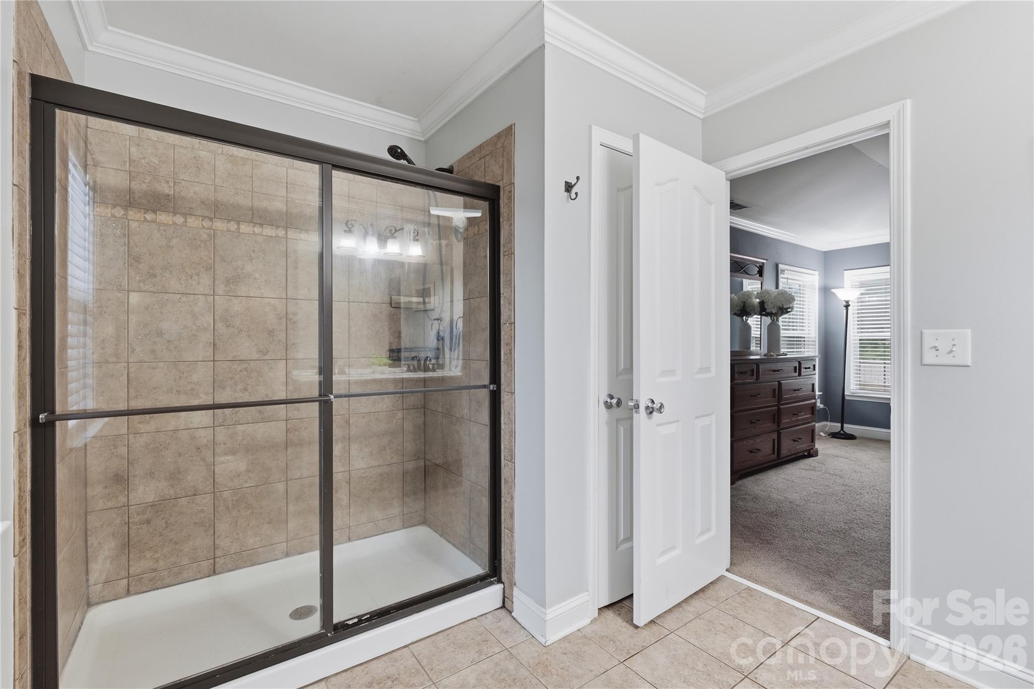 122 Colville Road Mooresville, NC 28117 - Photo 17 of 24 a bathroom with a glass shower door