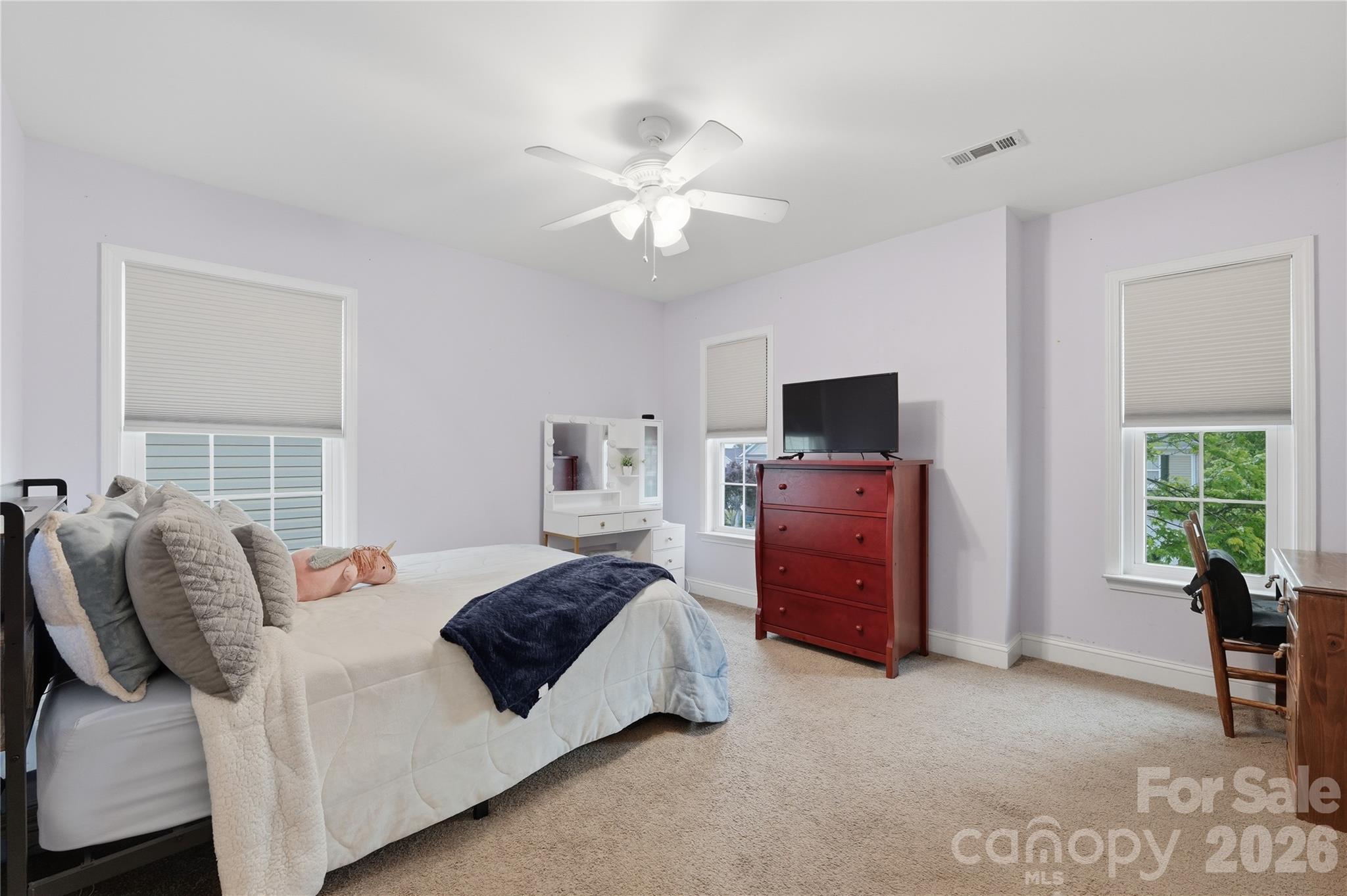 122 Colville Road Mooresville, NC 28117 - Photo 21 of 24 a bedroom with a bed and a flat screen tv