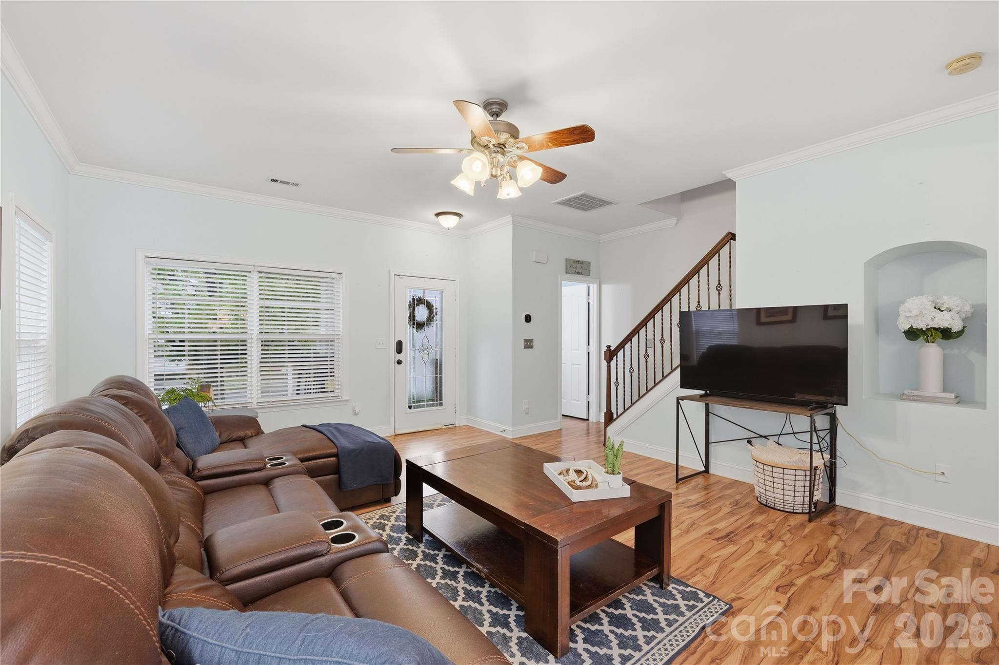 122 Colville Road Mooresville, NC 28117 - Photo 6 of 24 a living room with furniture a flat screen tv and a window