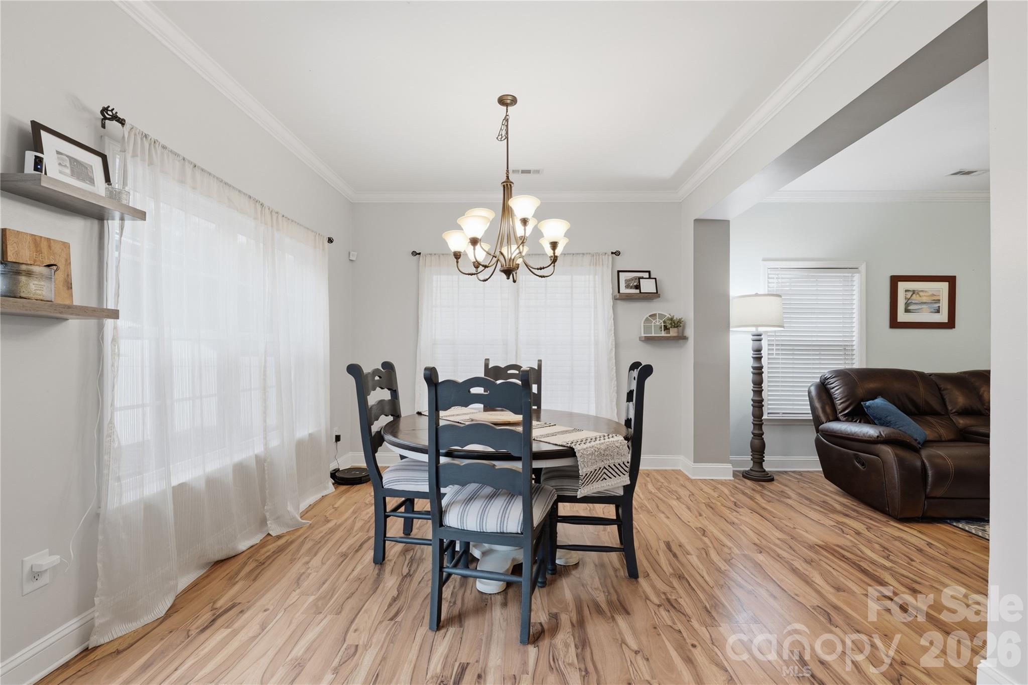 122 Colville Road Mooresville, NC 28117 - Photo 7 of 24 a view of a dining room with furniture and chandelier