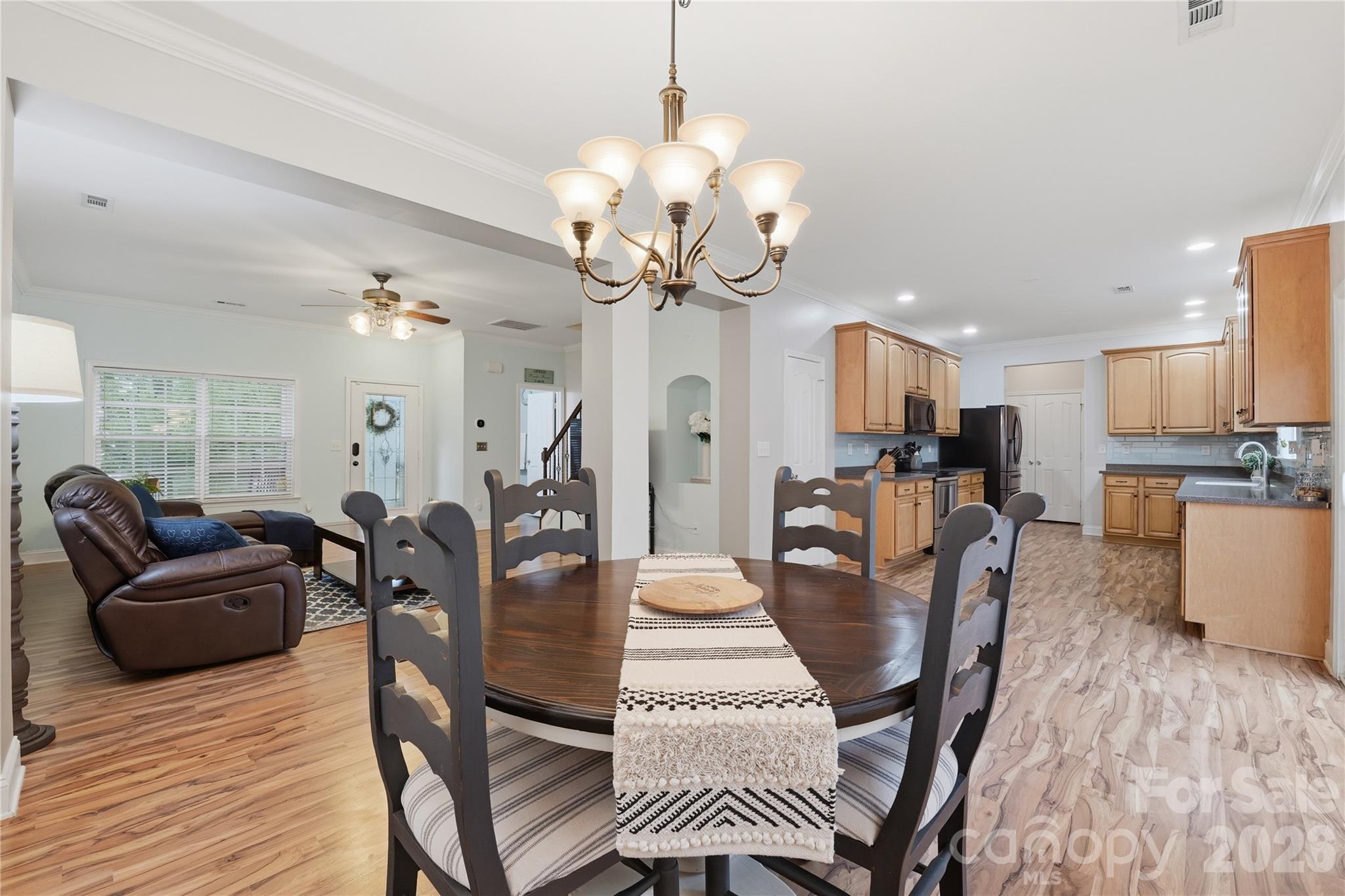 122 Colville Road Mooresville, NC 28117 - Photo 8 of 24 a view of a dining room with furniture and wooden floor