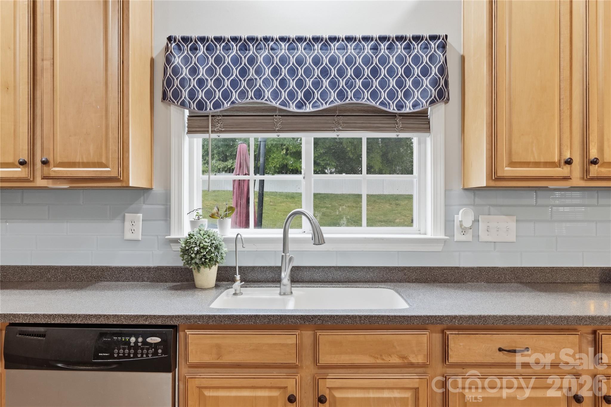 122 Colville Road Mooresville, NC 28117 - Photo 10 of 24 a kitchen with granite countertop a sink and a window