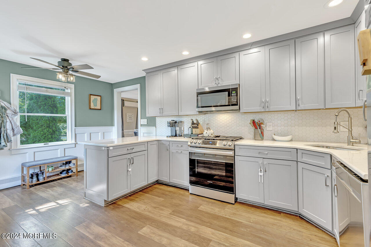 238 County Road 539 Cream Ridge, NJ 08514 - Photo 13 of 32 a kitchen with granite countertop a sink cabinets and window