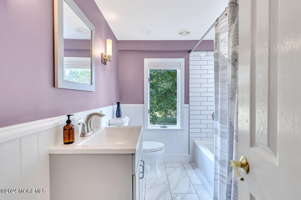 238 County Road 539 Cream Ridge, NJ 08514 - Photo 23 of 32 a bathroom with a sink a toilet and shower curtain