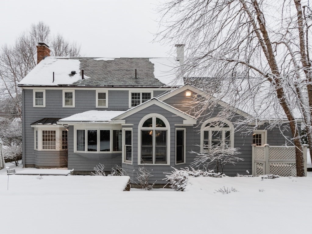 128 Dorset Road Newton, MA 02468 - Photo 33 of 36 a front view of a house with a yard covered in snow