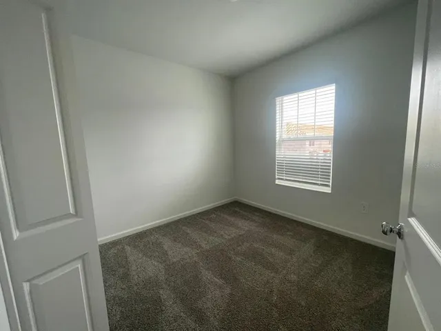 a bathroom with a double vanity sink mirror and shower