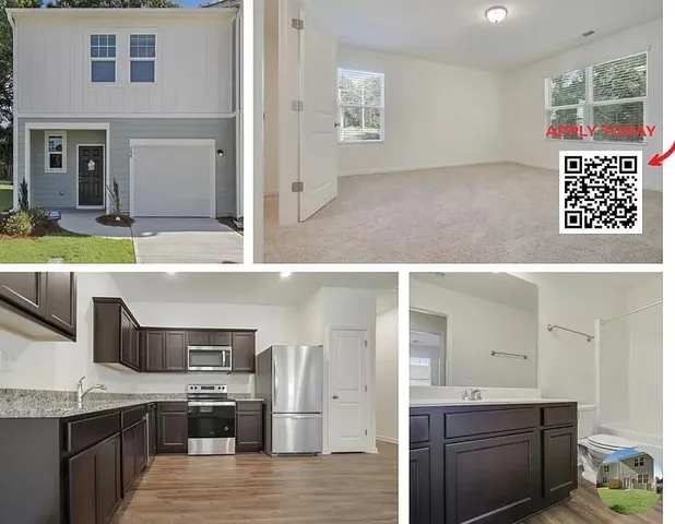 a view of kitchen with kitchen island granite countertop a sink and refrigerator