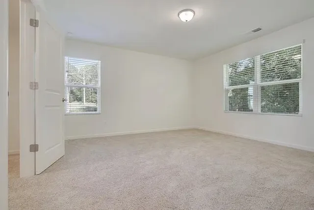 a bathroom with a sink toilet a mirror and shower