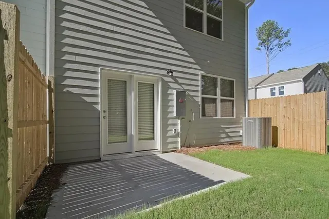a view of a backyard with a tree