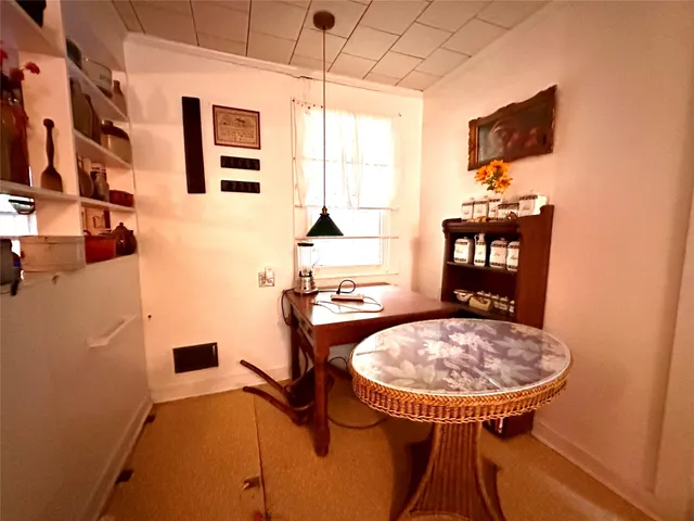 a room with table and chairs