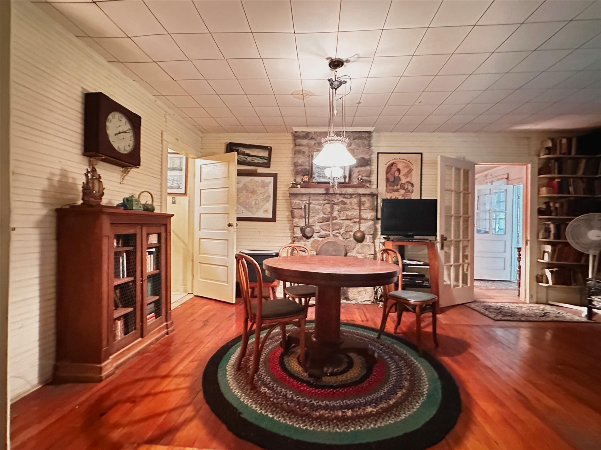 Rye Hill Road Monroe, NY 10950 - Photo 19 of 32 a dining room with furniture a chandelier and wooden floor