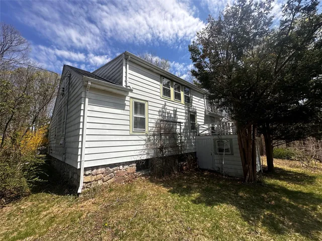 a backyard of a house with lots of green space