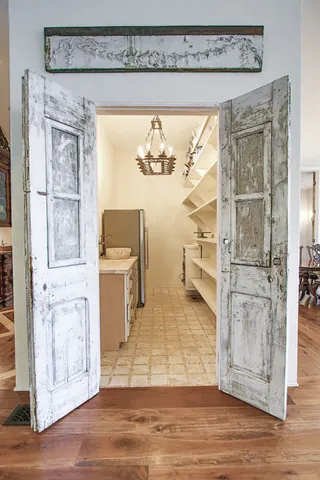 a view of a room with wooden floor and cabinet