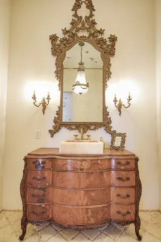 a living room with furniture hardwood floor and a window
