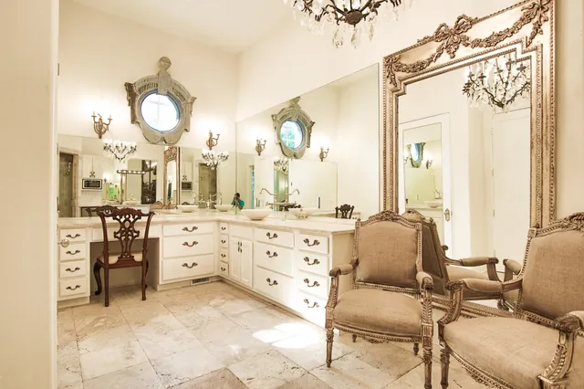 a bathroom with a sink vanity and a mirror