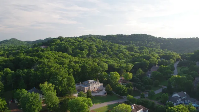 an aerial view of a city and mountain view in back