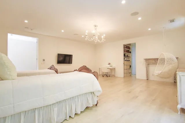 a bathroom with a sink a vanity and a mirror