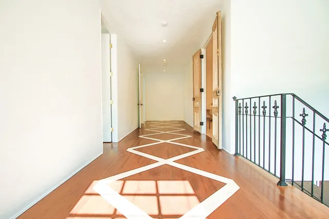 a bed room with a bed and a chair