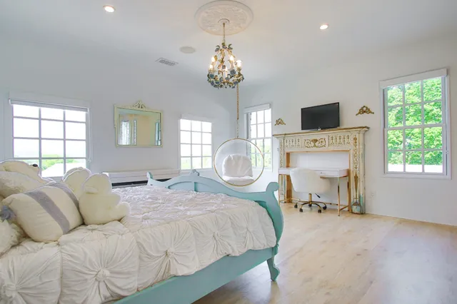 a bathroom with a glass shower door