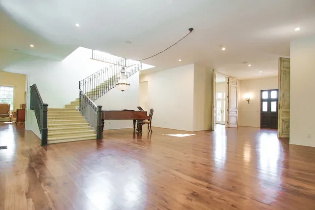a view of a livingroom with furniture and wooden floor