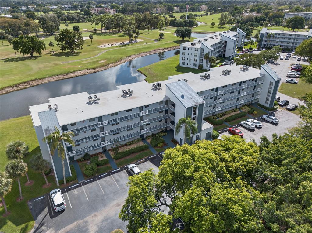 1550 Northwest 80th Avenue, Unit 303 Margate, FL 33063 - Photo 1 of 41 an aerial view of a house with a garden