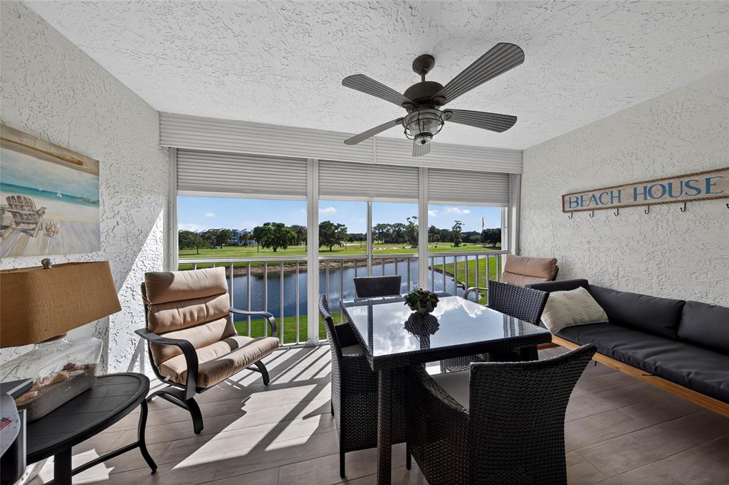 1550 Northwest 80th Avenue, Unit 303 Margate, FL 33063 - Photo 20 of 41 a view of a dining room with furniture window and outside view