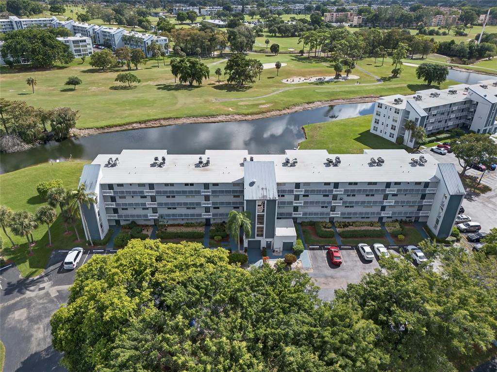1550 Northwest 80th Avenue, Unit 303 Margate, FL 33063 - Photo 2 of 41 a view of a swimming pool and outdoor space