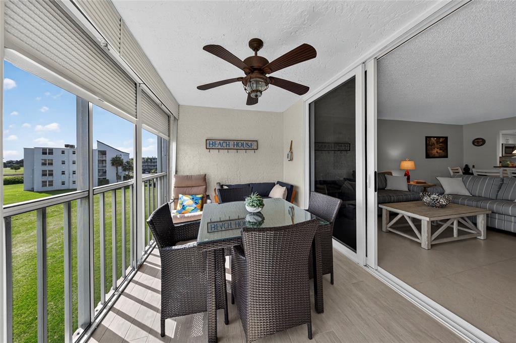 1550 Northwest 80th Avenue, Unit 303 Margate, FL 33063 - Photo 22 of 41 a view of a dining room with furniture window and wooden floor
