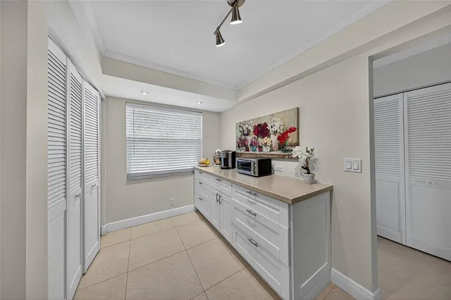 a kitchen with a cabinets and window