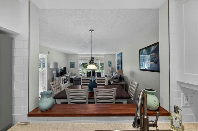 a living room with lots of furniture and gym equipment