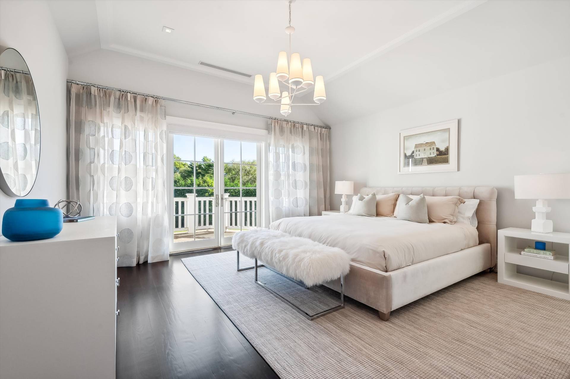 80 Cobb Road Water Mill, NY 11976 - Photo 18 of 35 a spacious bedroom with a bed and a large window