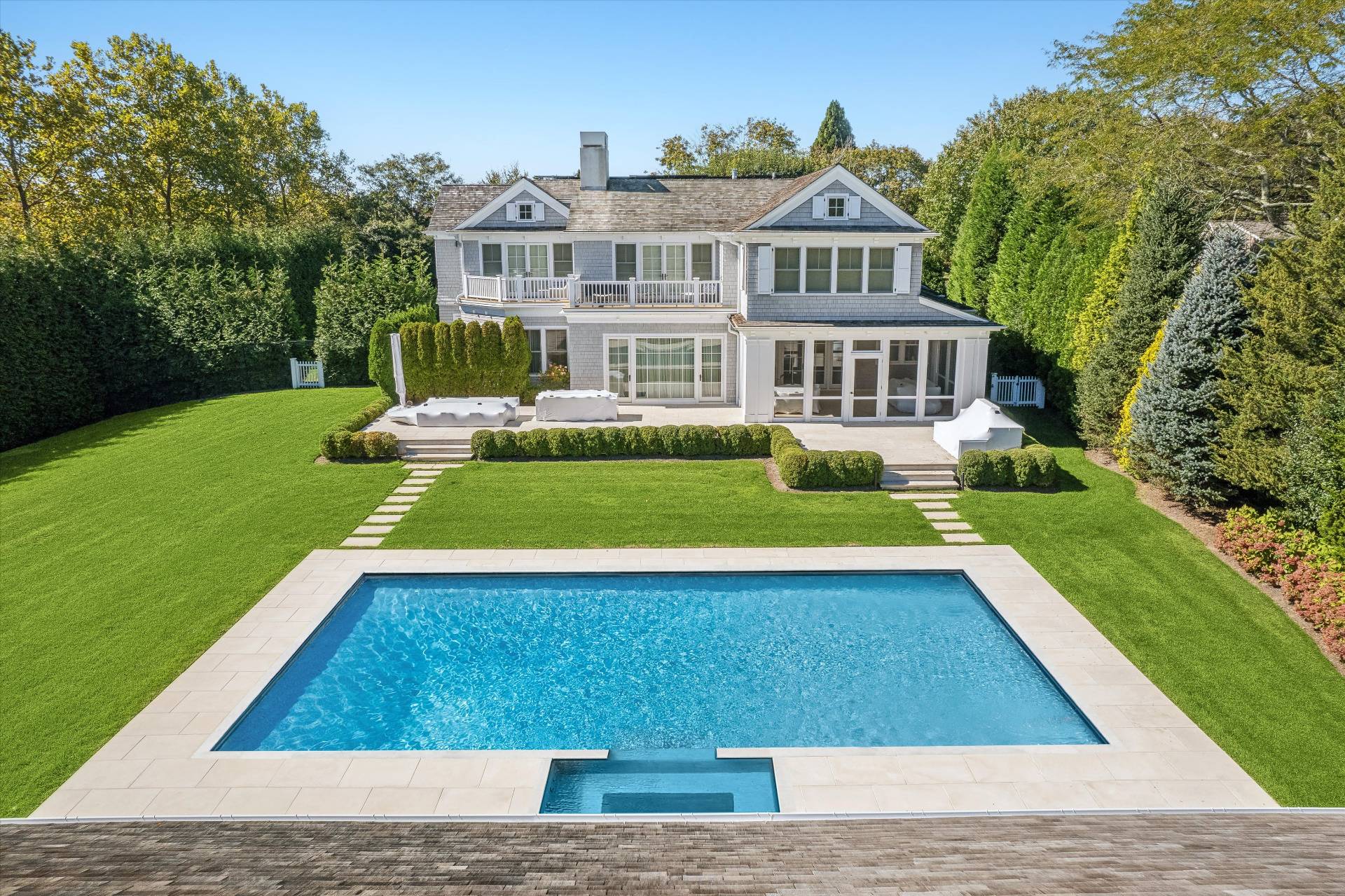 80 Cobb Road Water Mill, NY 11976 - Photo 30 of 35 a view of a house with a swimming pool