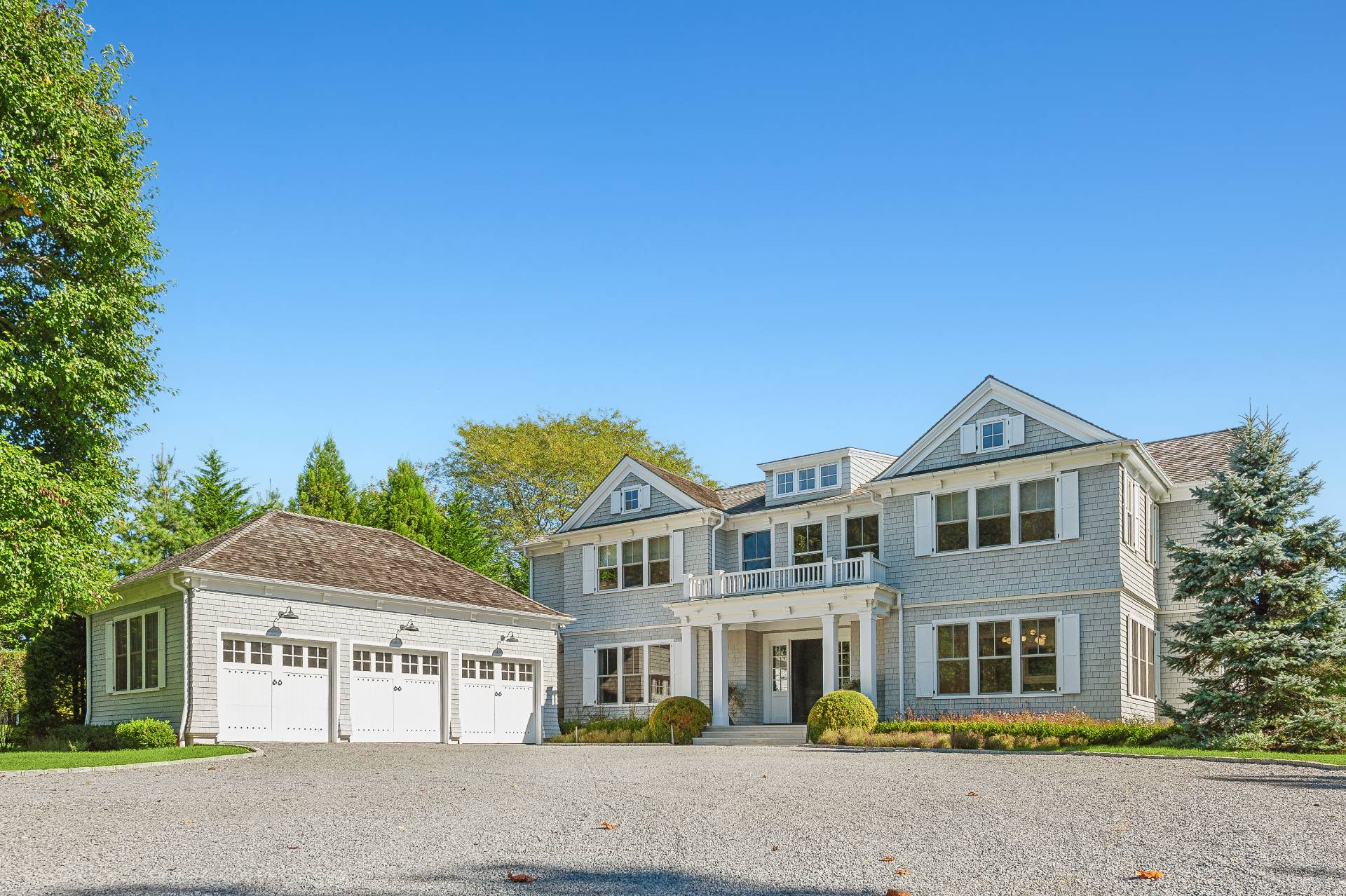 80 Cobb Road Water Mill, NY 11976 - Photo 3 of 35 a front view of a house with a garden