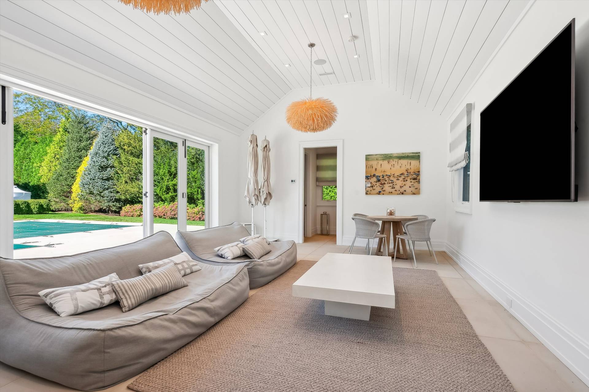 80 Cobb Road Water Mill, NY 11976 - Photo 35 of 35 a living room with furniture and a flat screen tv