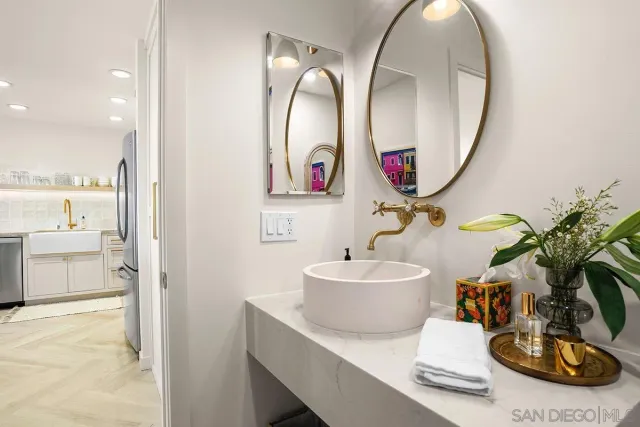 a bathroom with a sink and a mirror