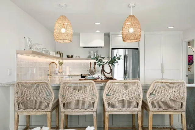 a view of a kitchen with furniture and a window