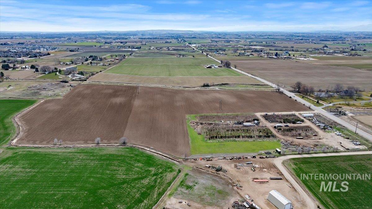 3850 South Black Cat Road Meridian, ID 83642 - Photo 6 of 7 Aerial view of property and surrounding area featuring rural landscape and large plots for crops