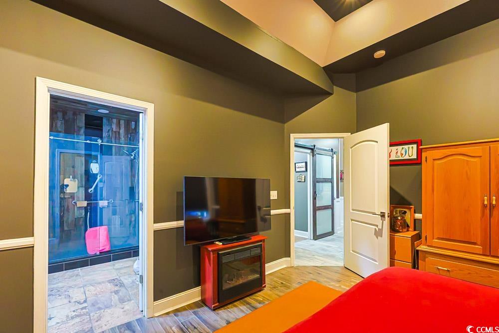 105 Rocko Drive Myrtle Beach, SC 29579 - Photo 13 of 38 Bedroom featuring a barn door and light wood-style floors