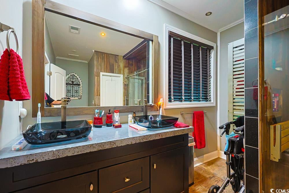 105 Rocko Drive Myrtle Beach, SC 29579 - Photo 15 of 38 Bathroom featuring double vanity, crown molding, a stall shower, and recessed lighting