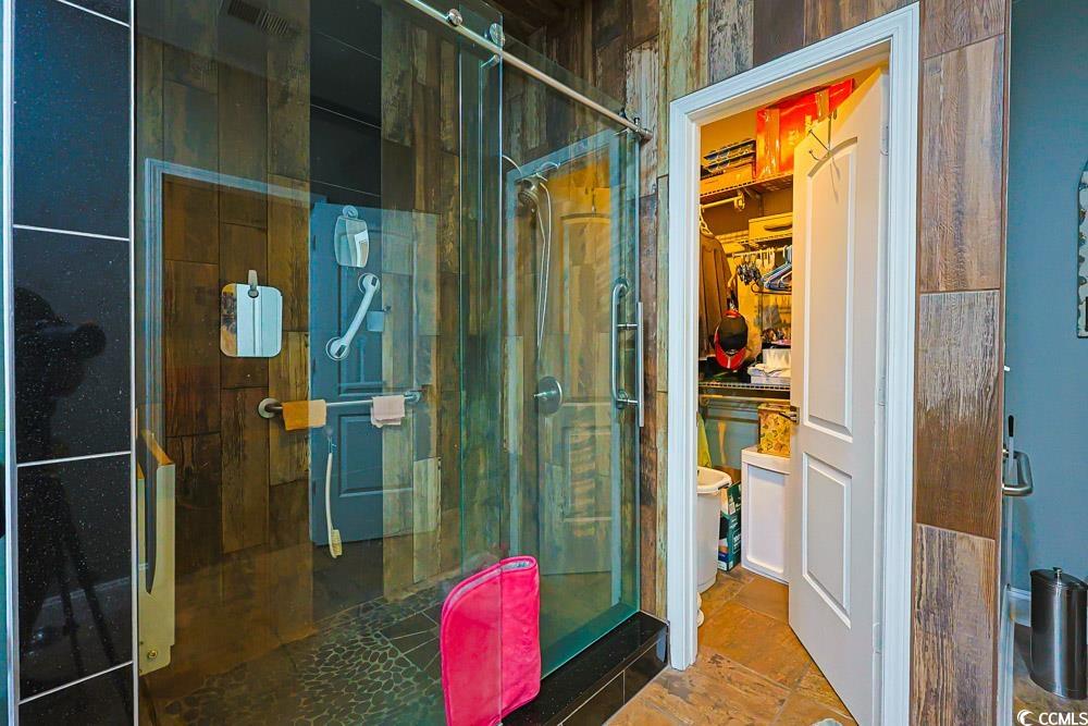 105 Rocko Drive Myrtle Beach, SC 29579 - Photo 16 of 38 Bathroom with a stall shower and a spacious closet