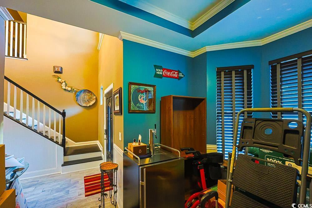 105 Rocko Drive Myrtle Beach, SC 29579 - Photo 17 of 38 Recreation room featuring crown molding, light wood-style flooring, and a raised ceiling