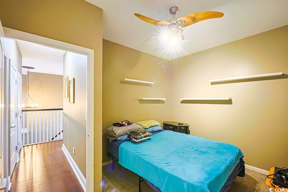 105 Rocko Drive Myrtle Beach, SC 29579 - Photo 23 of 38 Bedroom featuring ceiling fan and wood finished floors
