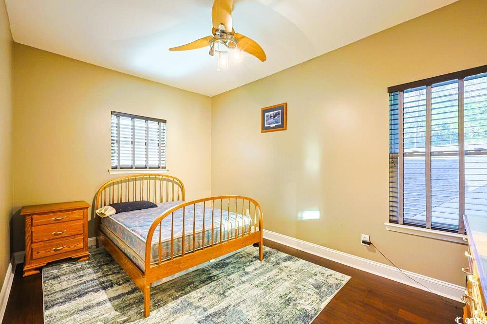 105 Rocko Drive Myrtle Beach, SC 29579 - Photo 24 of 38 Bedroom with dark wood-type flooring and ceiling fan