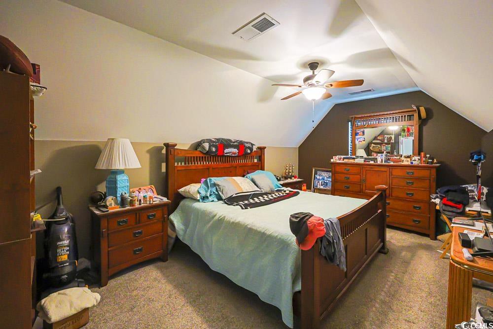 105 Rocko Drive Myrtle Beach, SC 29579 - Photo 28 of 38 Bedroom with light colored carpet, lofted ceiling, and a ceiling fan
