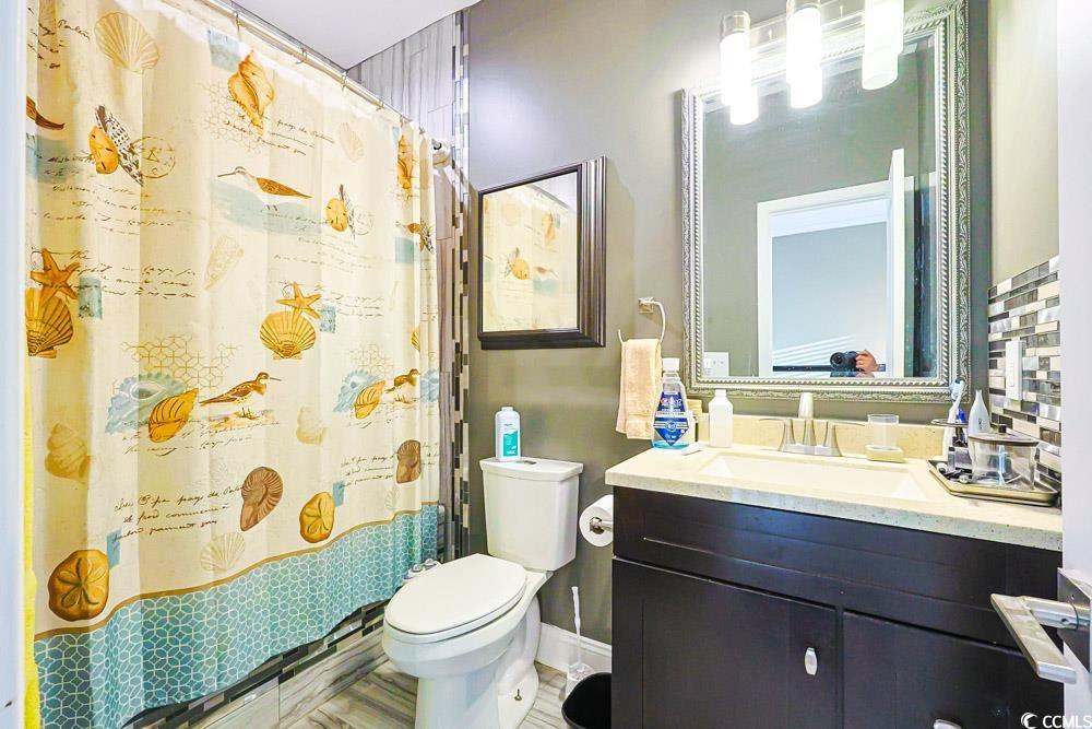 105 Rocko Drive Myrtle Beach, SC 29579 - Photo 30 of 38 Full bath featuring a shower with curtain and vanity