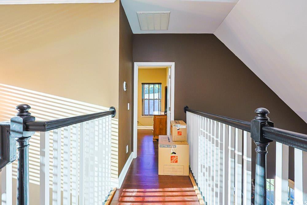 105 Rocko Drive Myrtle Beach, SC 29579 - Photo 31 of 38 Hall with an upstairs landing, dark wood-style flooring, and lofted ceiling