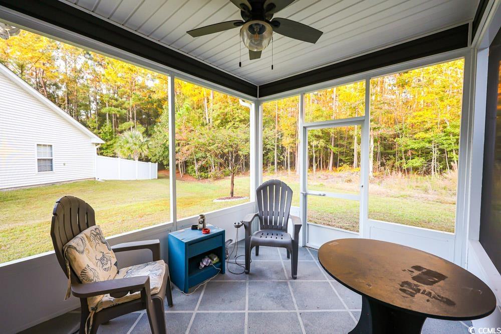 105 Rocko Drive Myrtle Beach, SC 29579 - Photo 37 of 38 Sunroom featuring ceiling fan and view of scattered trees